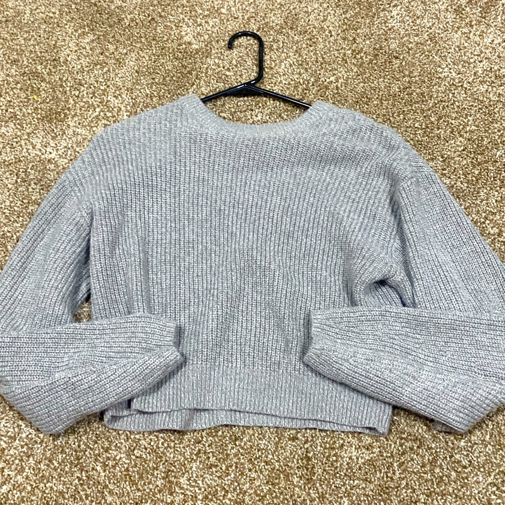 A gray small sweater that is excellent for this cold nights :)